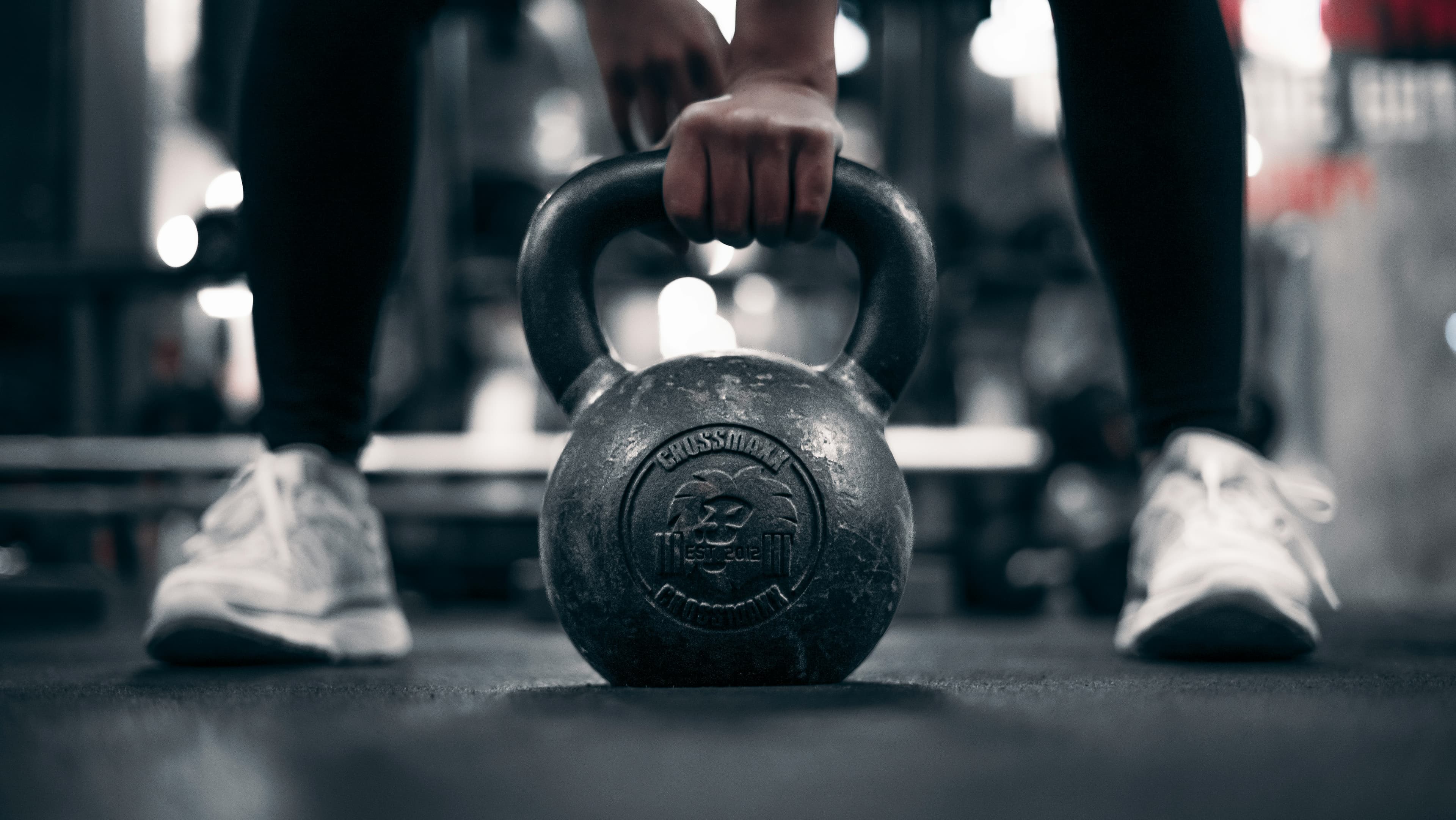 Strength training — kettlebell workout in gym